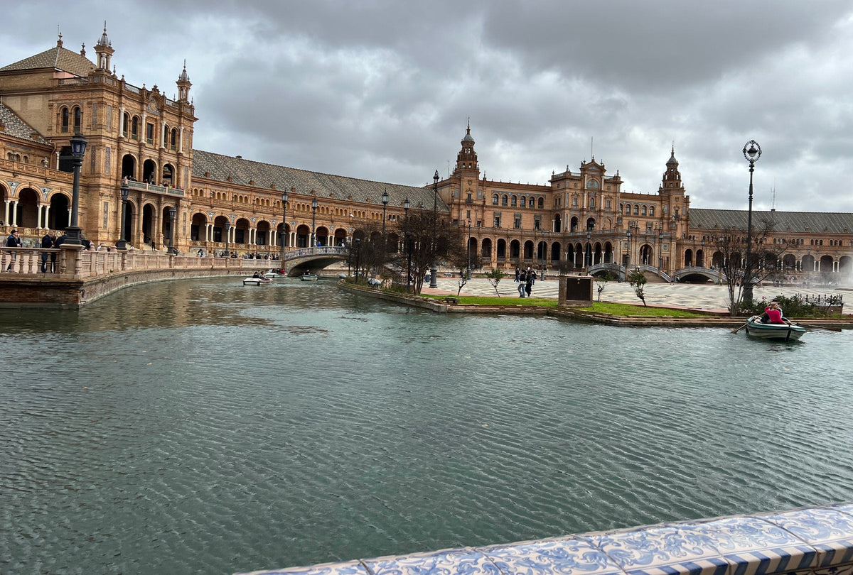 The canal, bridges and brick crescent of Plaza de España in Seville