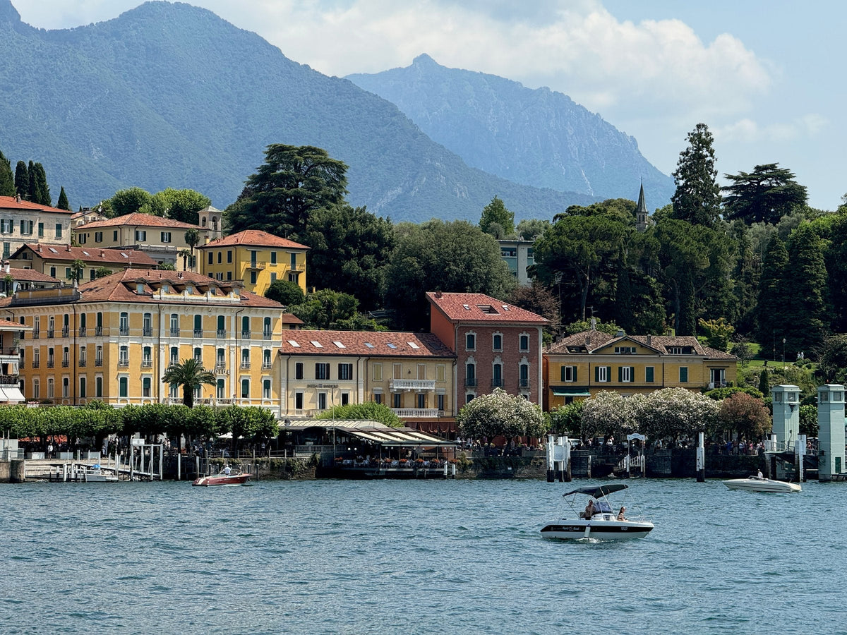 Bellagio's lakefront hotels and the mountains, seen from the water